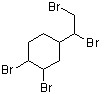 A six-carbon ring, with a CHCH2 group, which has a Br atom bonded to its first and second carbons, attached to the first carbon and a Br atom bonded to the third (clockwise) and the fourth carbon atoms of the ring.
