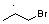 A three-carbon chain, with a dot above the second (from left to right) carbon and a Br atom attached to the third carbon.